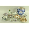 A collection of 18th and 19th century ceramics, including a blue and white jardiniere with open side... 