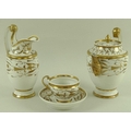 An unusual porcelain tea set, likely continental but possibly Arabic, the bodies heavily gilded with... 