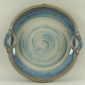 Will Illsley (Rutland, b. 1948): a large two handled pottery dish or centre piece, spiralling blue g... 