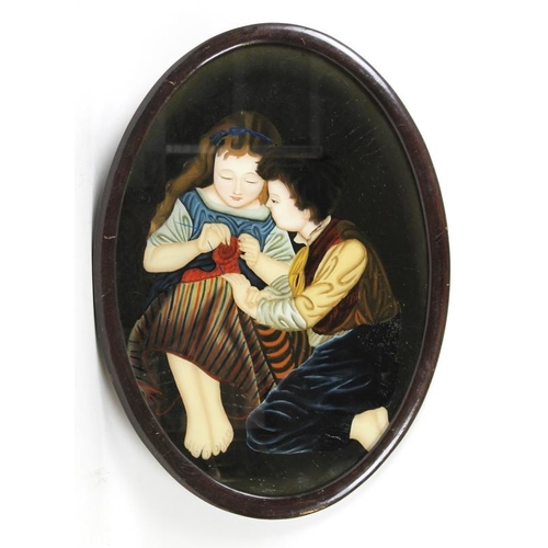 603 - An early to mid 20th century oval reverse painting on glass of two children, the girl knitting, the ... 