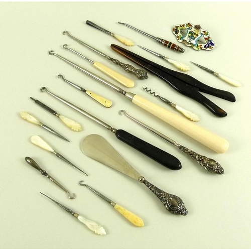 778 - A group of dressing table items, including three silver repousee handled button hooks, a gentleman's... 