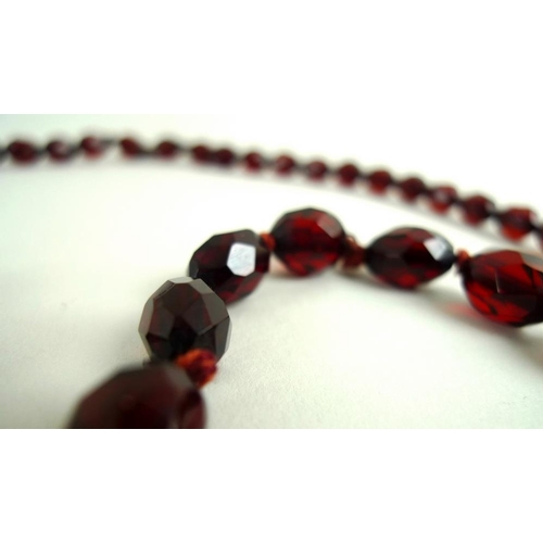 785 - Two similar strands of vintage facet cut amber beads of graduated size, one strand with seventy five... 