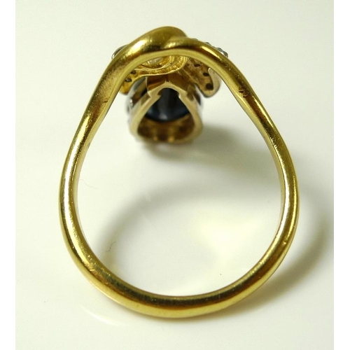 786 - An 18ct gold, diamond and sapphire ring of unusual hand crafted organic design, the teardrop shaped ... 