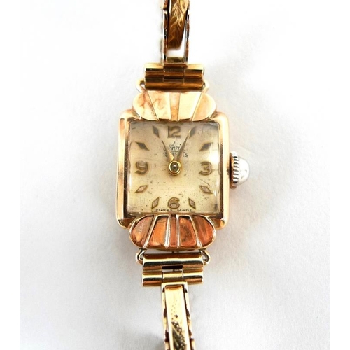 799 - An Art Deco 9ct gold Avia lady's watch, square pearlised dial, domed plastic crystal, with safety ch... 