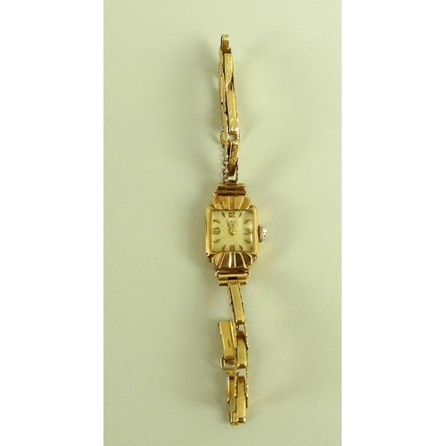 799 - An Art Deco 9ct gold Avia lady's watch, square pearlised dial, domed plastic crystal, with safety ch... 