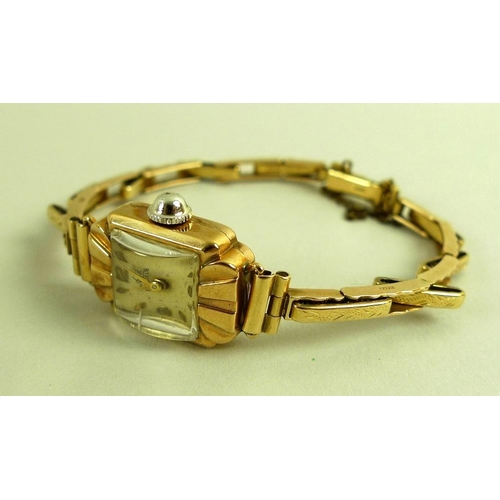 799 - An Art Deco 9ct gold Avia lady's watch, square pearlised dial, domed plastic crystal, with safety ch... 