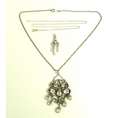 807 - An unusual late 19th century pendant, set with ten drop very pale blue/white stones within a silver ... 