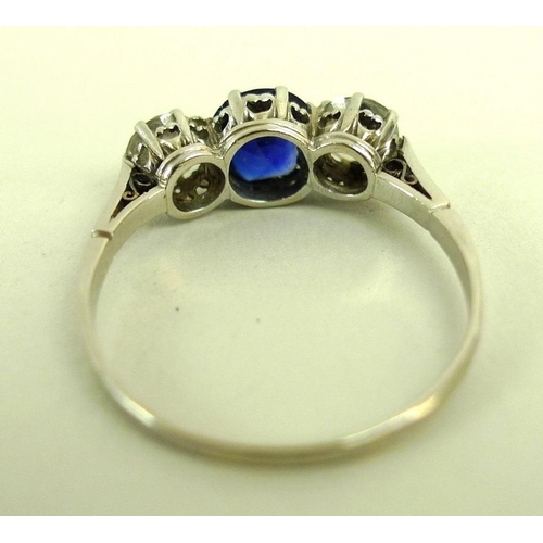 821 - A platinum, diamond and synthetic sapphire three stone ring with central sapphire of approximately 1... 