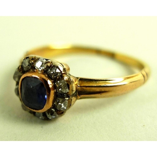 822 - An Edwardian 18ct gold, diamond and sapphire dress ring with central emerald cut sapphire surrounded... 