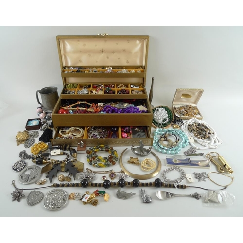 823 - A large collection of costume jewellery including an Esser of Canada faux amber pear pendant, jet ne... 