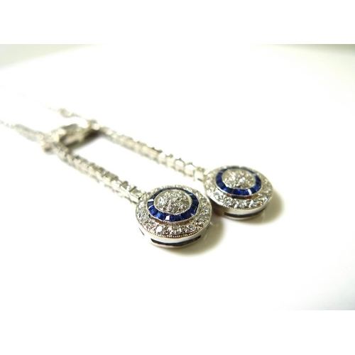 831 - An Art Deco style diamond and sapphire pendant necklace, set with asymmetric circlet drops, 9.7g tot... 