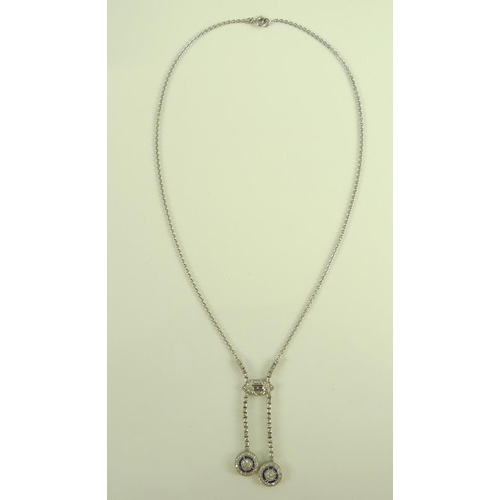 831 - An Art Deco style diamond and sapphire pendant necklace, set with asymmetric circlet drops, 9.7g tot... 