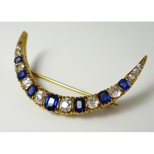 838 - An 18ct gold, diamond and sapphire crescent brooch, possibly Russian, set with twelve diamonds of gr... 