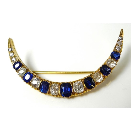 838 - An 18ct gold, diamond and sapphire crescent brooch, possibly Russian, set with twelve diamonds of gr... 