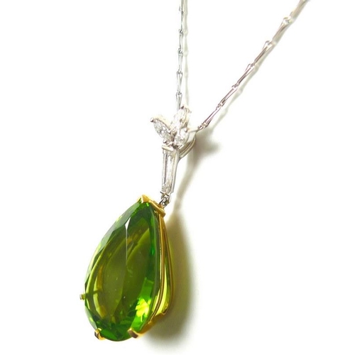 840 - An exceptional and large peridot, diamond and 18ct gold pendant, the pear cut peridot in the region ... 