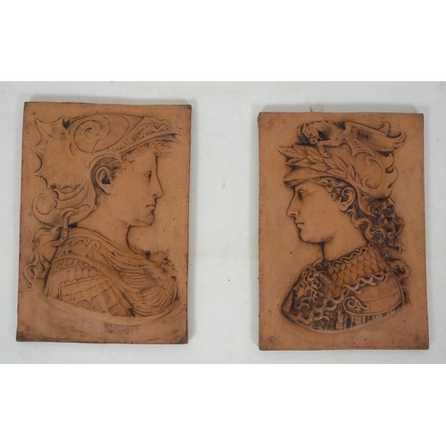 841 - A pair of Renaissance style terracotta garden wall plaques, each 34 by 9.5 by 48cm high. (2)