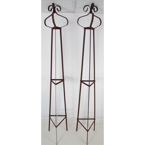 844 - A pair of modern hand forged iron garden obelisks, of triangular section with scrolling finials, eac... 