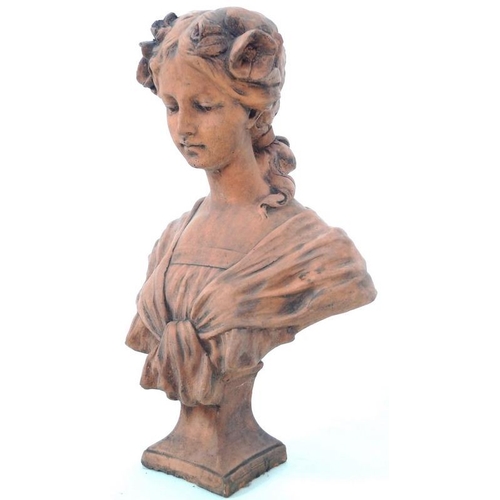 847 - A modern terracotta bust, modelled as a young girl in Art Nouveau style with flowers in her hair, 31... 