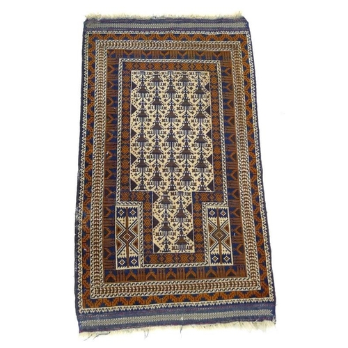 848 - A Kazak rug of geometric design, with cream ground, madder and dark blue decoration, finely woven fr... 