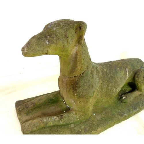 850 - A pair of 19th century carved stone figures, modelled as recumbent greyhounds, on integral rectangul... 