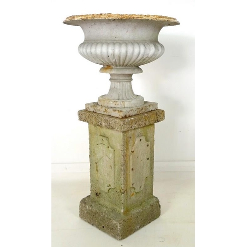 851 - A Victorian cast iron garden urn, with lobed body and squared pedestal base, together with a square ... 