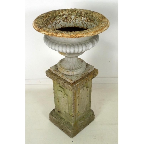 851 - A Victorian cast iron garden urn, with lobed body and squared pedestal base, together with a square ... 