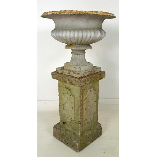 851 - A Victorian cast iron garden urn, with lobed body and squared pedestal base, together with a square ... 