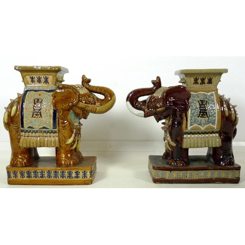 856 - A pair of Chinese style ceramic garden seats, in the form of elephants, in treacle glazes, 55 by 25 ... 