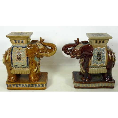 856 - A pair of Chinese style ceramic garden seats, in the form of elephants, in treacle glazes, 55 by 25 ... 