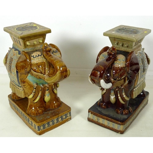 856 - A pair of Chinese style ceramic garden seats, in the form of elephants, in treacle glazes, 55 by 25 ... 