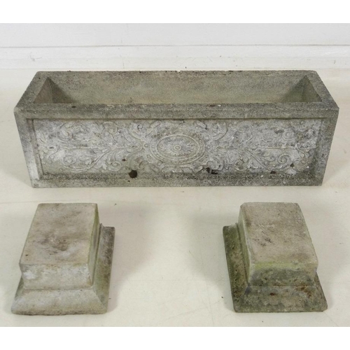 859 - Three modern reconstituted stone garden planters, each raised on two separate block feet, each 65 by... 