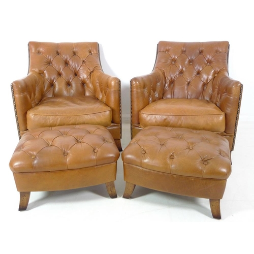 860 - A pair of brown leather button back arm chairs, late 20th century, raised on sabre legs, 75 by 89 by... 