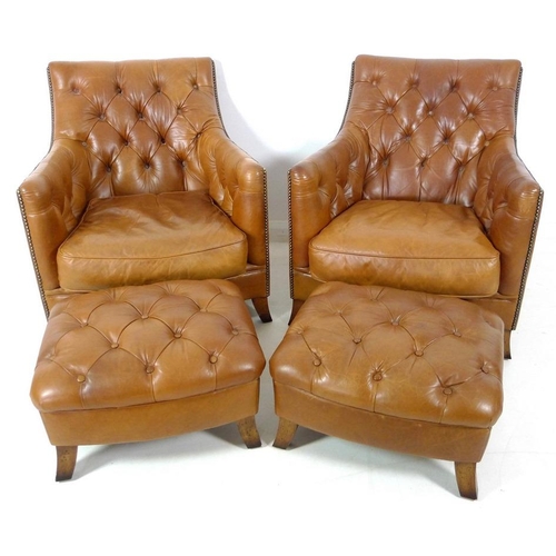 860 - A pair of brown leather button back arm chairs, late 20th century, raised on sabre legs, 75 by 89 by... 