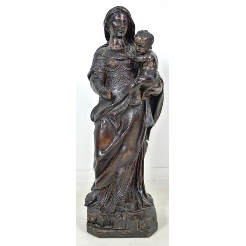 861 - A French carved and painted softwood Madonna and child, 17th century, raised on a square base with c... 