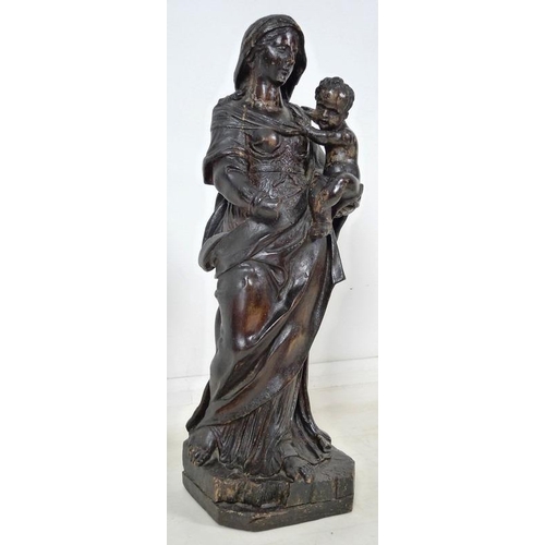 861 - A French carved and painted softwood Madonna and child, 17th century, raised on a square base with c... 