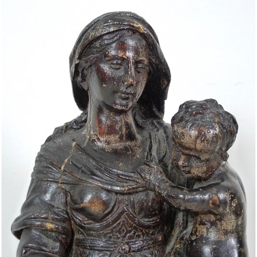 861 - A French carved and painted softwood Madonna and child, 17th century, raised on a square base with c... 