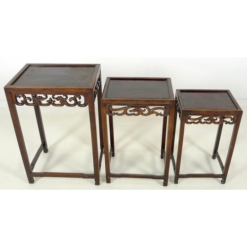 862 - A nest of three Chinese rosewood occasional tables, late 19th / early 20th century, each of rectangu... 