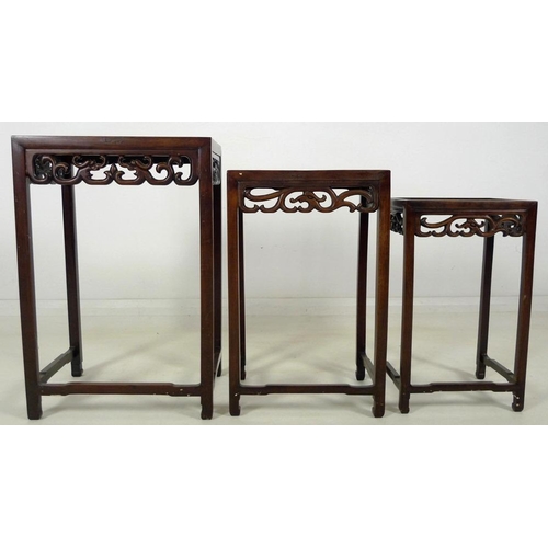 862 - A nest of three Chinese rosewood occasional tables, late 19th / early 20th century, each of rectangu... 