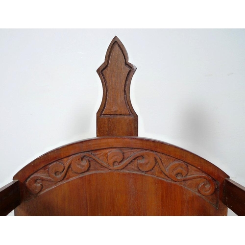 865 - An early to mid mahogany cradle and stand, carved in Arts and Crafts Gothic style, with bone or ivor... 