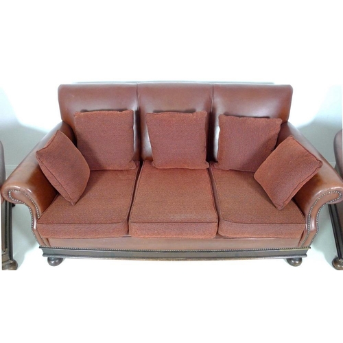 866 - A brown leather three piece suite, mid 20th century, comprising a three seater sofa, 180 by 83 by 90... 