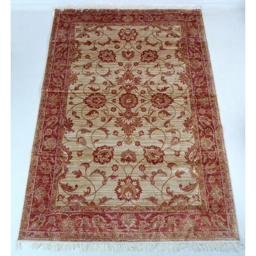 868A - A modern Zeigler rug with cream ground and red scrolling foliate decoration, 230 by 160cm.