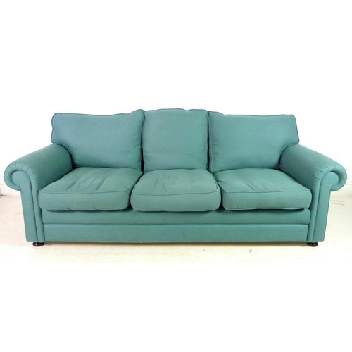 869A - A modern three seater Chesterfield style sofa, with loose feather cushions, flattened bun feet, upho... 