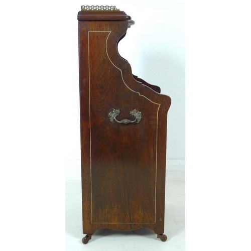 870 - A late Victorian purdonium, the rosewood body line and marquetry inlaid with foliage, upper half wit... 