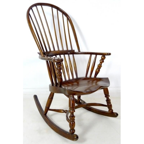 870A - A 19th century Windsor armchair, later amended with rocking base, high spindle back, shaped armrest ... 