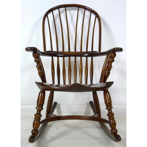 870A - A 19th century Windsor armchair, later amended with rocking base, high spindle back, shaped armrest ... 