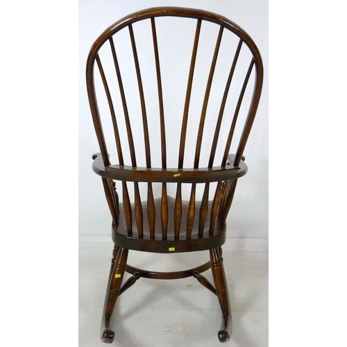 870A - A 19th century Windsor armchair, later amended with rocking base, high spindle back, shaped armrest ... 