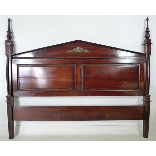 872 - A 19th century mahogany bed head, two panels, turned finials and pointed pediment, with applied flow... 