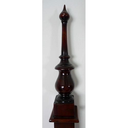 872 - A 19th century mahogany bed head, two panels, turned finials and pointed pediment, with applied flow... 