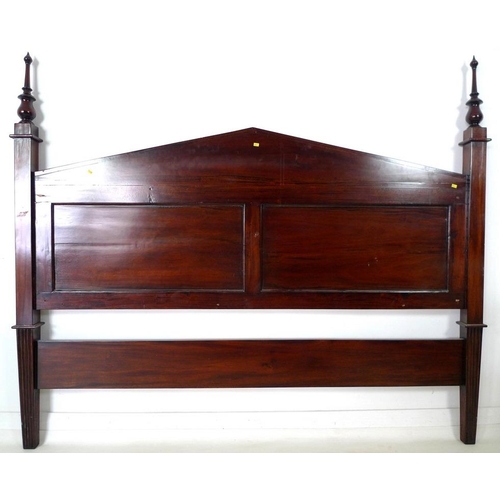 872 - A 19th century mahogany bed head, two panels, turned finials and pointed pediment, with applied flow... 