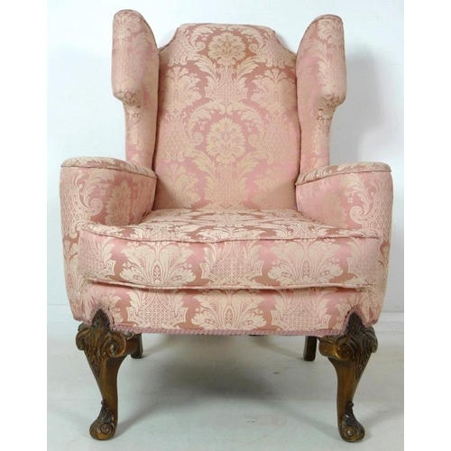 874 - A Queen Anne style wing back arm chair, early to mid 20th century, raised on carved cabriole front l... 